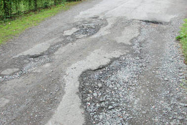 How can I claim for damage caused by potholes?