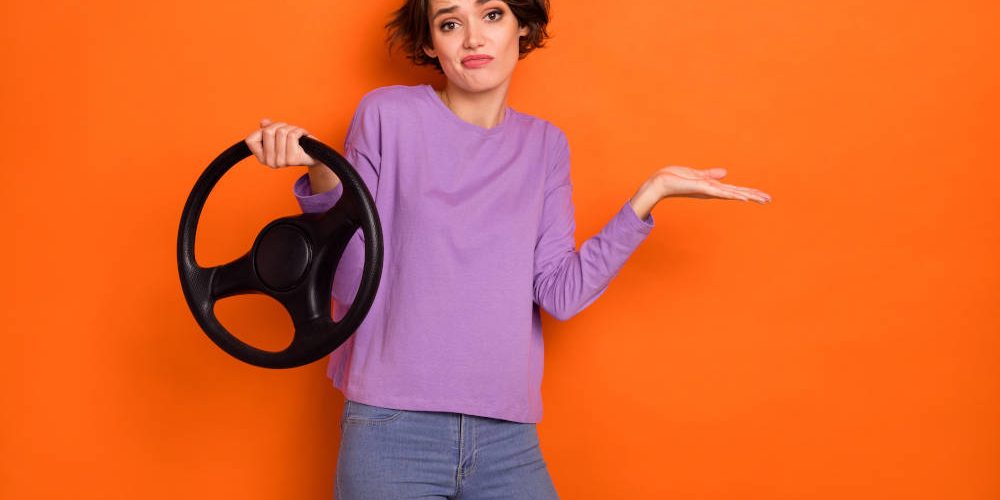 Photo-Of-Doubtful-Unsure-Girl-Dressed-Purple-Pullover-Riding-Auto